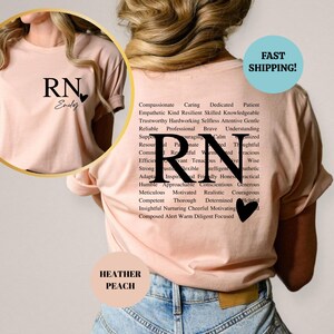 May include: A pink t-shirt with the letters RN and the name "Endey" on the front. The back of the shirt has the letters RN with a list of positive adjectives describing a nurse.