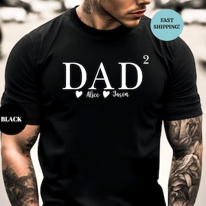 May include: Black t-shirt with white text that reads "DAD^2" with two hearts and the names "Alice" and "Jason" underneath.