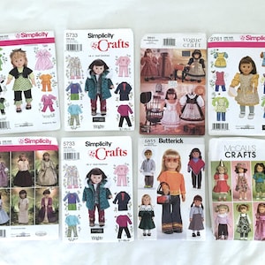 May include: A collection of eight sewing patterns for making doll clothes. The patterns are for different dolls, including American Girl dolls, and feature a variety of styles, including dresses, shirts, pants, and coats. The patterns are from Simplicity, Vogue, Butterick, and McCall's.