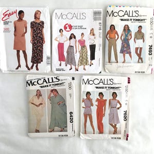 May include: Five different sewing patterns for clothing. The patterns are all from McCall's and feature different styles of dresses, skirts, and tops. The patterns are all in black and white and feature illustrations of the finished garments.