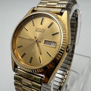 Vintage Seiko Quartz Men’s Watch – Gold Tone, Day/Date, 34mm (1970s–1980s Era)