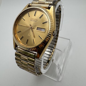 Vintage Seiko Quartz Men’s Watch – Gold Tone, Day/Date, 34mm (1970s–1980s Era)