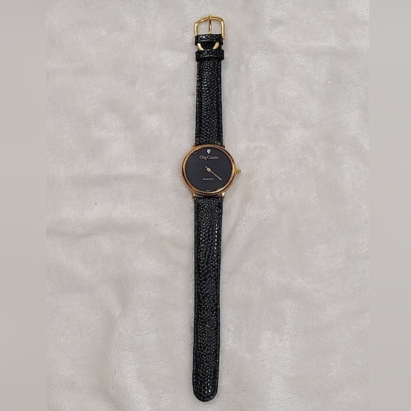 Vintage Oleg Cassini Women's Gold Tone Watch On Black Leather Band