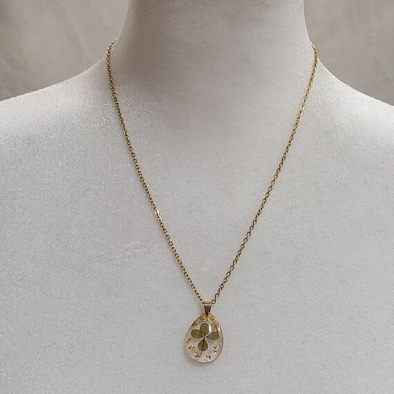 Gold Tone Encased Four Leaf Clover Necklace
