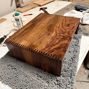 Walnut turntable riser crafted with box joint joinery