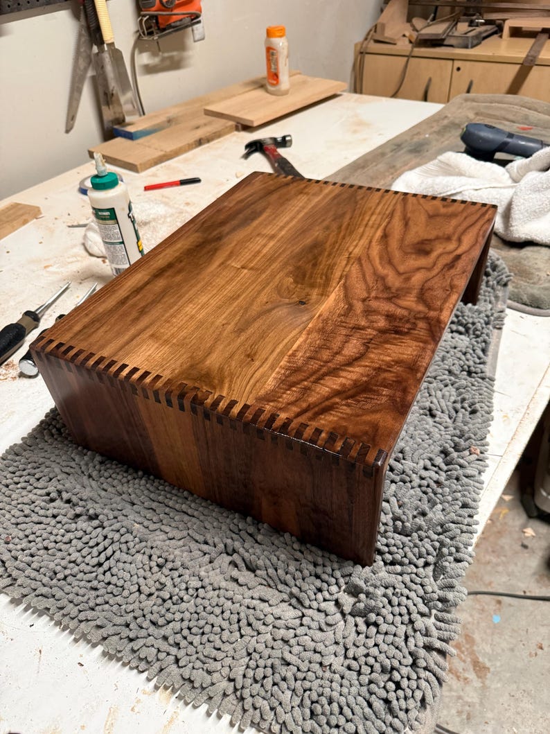 Walnut turntable riser crafted with box joint joinery