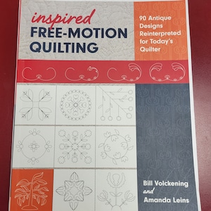 May include: Book cover with the title "inspired FREE-MOTION QUILTING" and a subtitle "90 Antique Designs Reinterpreted for Today's Quilter". The cover features a variety of quilting designs in black and white, with a red and orange background.