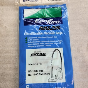 May include: A package of 6 blue and white EcoPure Ultrafiltration Vacuum Bags for RC-1400 and RC-1500 Canisters. The package shows a vacuum cleaner with a hose and a blue and white label with the text "Genuine RKCAR".