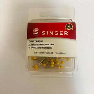 May include: A package of 75 yellow-headed quilting pins from Singer, the world's #1 sewing brand. The pins are 1 3/4 inches long and are packaged in a clear plastic container with a hang hole.