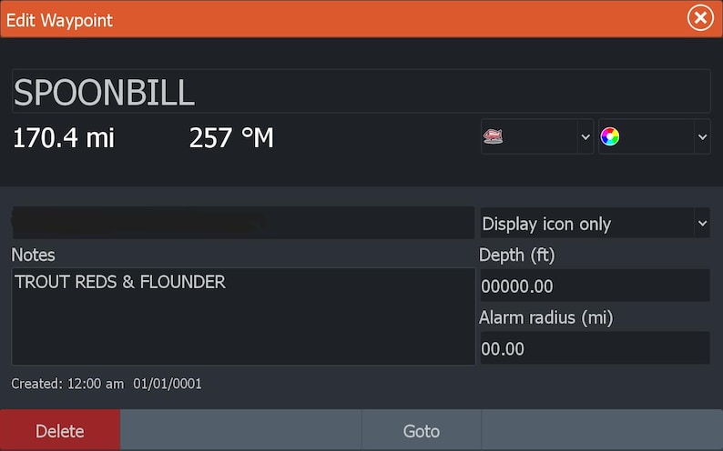May include: A dark grey digital display with orange header text that reads "Edit Waypoint." The display shows waypoint details, including "SPOONBILL," distance of 274.3 km, and bearing 257&deg;M. Additional fields include notes and depth.