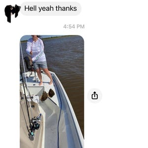 May include: A screenshot of a mobile phone conversation. The image shows a person on a boat with fishing rods, and two fish. The text in the conversation includes "Hell yeah thanks" and "Your Flounder hole was on point."