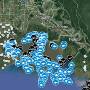 May include: A mobile phone screen displays a map with numerous blue and black location markers, indicating fishing waypoints. The map shows a coastal area with land and water features. The app name "VBay Fishing Waypoints" is visible at the bottom.