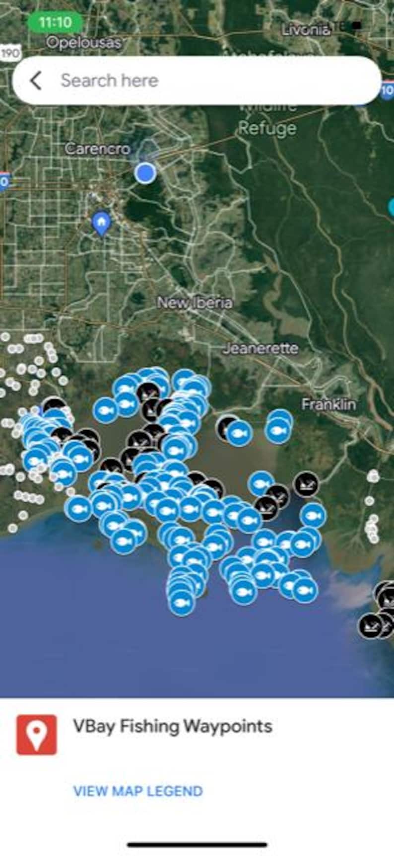 May include: A mobile phone screen displays a map with numerous blue and black location markers, indicating fishing waypoints. The map shows a coastal area with land and water features. The app name "VBay Fishing Waypoints" is visible at the bottom.