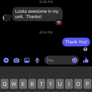 May include: Screenshot of a Facebook Messenger conversation on a smartphone. The screen displays text messages in a chat bubble format against a black background. The messages include phrases like "Can I get number" and "Looks awesome." A keyboard is visible.