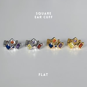May include: Four square ear cuffs in silver and gold, each featuring colourful square gemstones. The text "SQUARE EAR CUFF" and "FLAT" are displayed in white font.