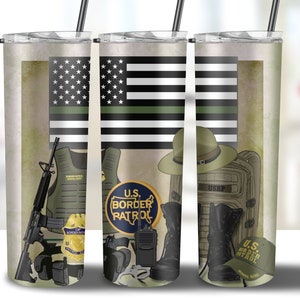 May include: Three stainless steel tumblers with a green, black, and white American flag design. The tumblers feature a variety of images related to the U.S. Border Patrol, including a badge, a hat, a backpack, boots, and a gun. The text "U.S. Border Patrol" is featured on each tumbler.