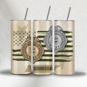 May include: Three stainless steel tumblers with a design featuring a distressed American flag, a green and gold Tennessee Highway Patrol badge, and the text "Tennessee Highway Patrol".