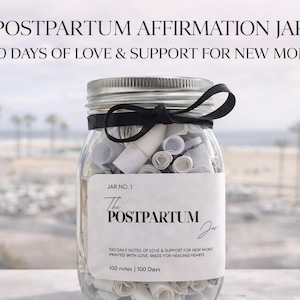 May include: A clear glass jar filled with rolled-up notes, tied with a black ribbon. The jar has a label that reads "POSTPARTUM AFFIRMATION JAR" and "100 DAYS OF LOVE & SUPPORT FOR NEW MOMS". The background shows a blurred beach scene.