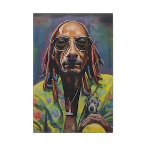 May include: A colourful portrait of a person with dreadlocks wearing sunglasses and a yellow floral print jacket. A small grey dog is held in the person's arms. The background features a colourful, abstract design.