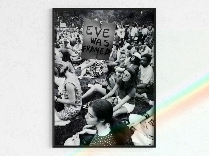 Black and White photograph of feminist protest sit-in, featuring an "Eve Was Framed" protest poster. Available as a direct download from Wilo Art Gallery on Etsy.