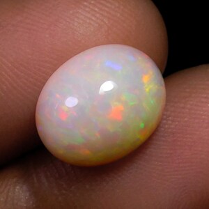 Ethiopian Opal Cabochon: Oval Rainbow Fire Gemstone (12X10X6 mm)