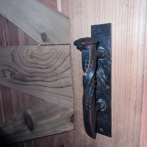 Hand forged railroad spike door handle