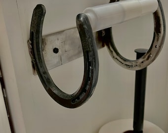 Horseshoe toilet paper holder