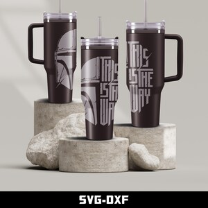 May include: Three stainless steel tumblers with lids and straws. One tumbler features a Mandalorian helmet graphic, and the other two tumblers feature the text "This is the way".
