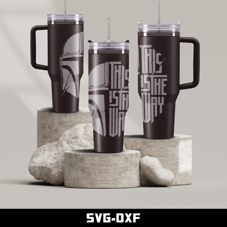 May include: Three stainless steel tumblers with lids and straws. One tumbler features a Mandalorian helmet graphic, and the other two tumblers feature the text "This is the way".