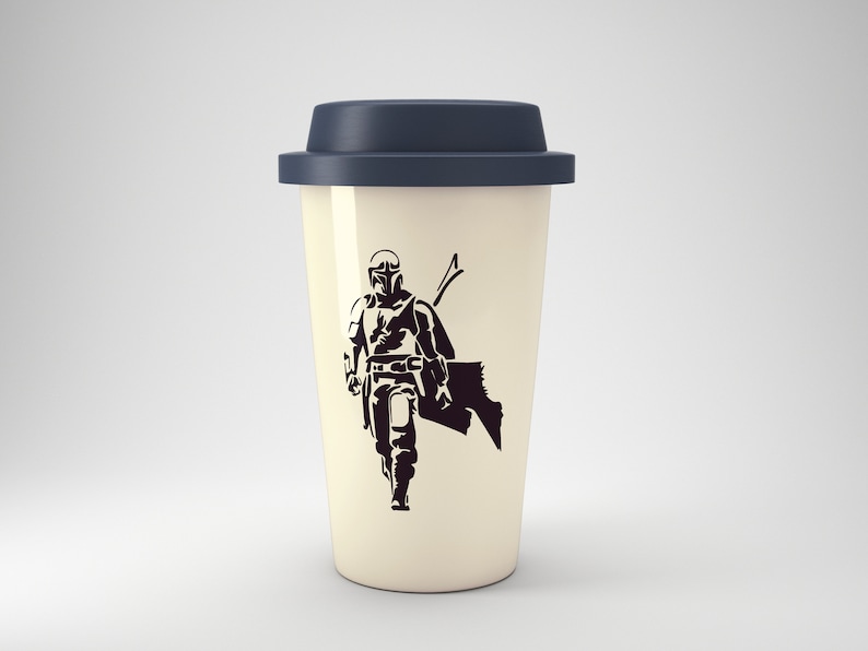 May include: A white travel mug with a black silhouette of a Mandalorian character. The mug has a dark blue lid.