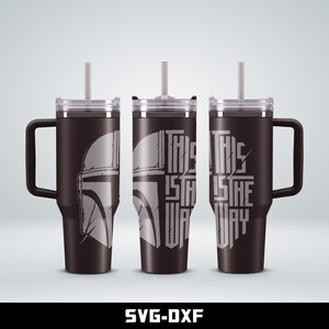 May include: Three stainless steel tumblers with lids and straws. The tumblers are black with a white graphic of a Mandalorian helmet and the text "This is the way".
