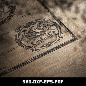May include: A detailed map illustration, featuring a mountain range within an ornate frame, is etched onto a wooden surface. The map includes text such as "Khand" and "Near Barad". The bottom of the image displays the text "SVG-DXF-EPS-PDF".