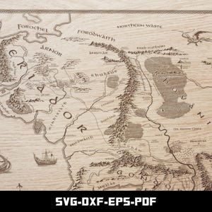 May include: A detailed map with intricate line drawings of a fantasy world, featuring geographical features, text labels, and illustrations of ships and mythical creatures. The map is printed on a light brown, wood-grain textured surface. The text "SVG-DXF-EPS-PDF" is at the bottom.