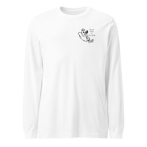 May include: White long-sleeved t-shirt with a black ghost graphic and the text "Ghost Stuff is Our Stuff".