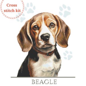 May include: Cross stitch kit featuring a Beagle dog with brown and white fur. The dog is looking directly at the viewer with a curious expression. The image is surrounded by paw prints.