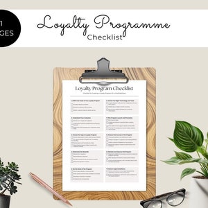 May include: A printable checklist for creating a loyalty program for a small business. The checklist is on a wooden clipboard with a black clip. The checklist is titled "Loyalty Program Checklist" and has 10 sections with checkboxes.