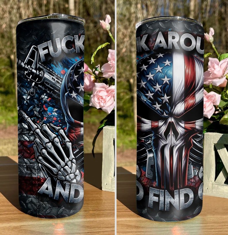 May include: A stainless steel tumbler with a black and red design featuring a skull with an American flag, a gun, and the text "F**k Around And Find Out".