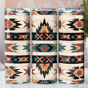 May include: Three stainless steel tumblers with a geometric pattern in shades of red, orange, blue, and black on a white woodgrain background.
