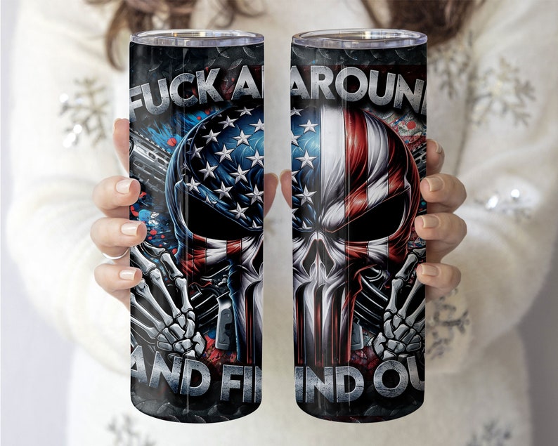 May include: A stainless steel tumbler featuring a skull graphic and the text "F**k Around And Find Out". The skull is decorated with an American flag design.