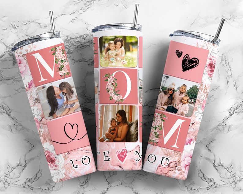 May include: A pink and white stainless steel tumbler with a floral design and photos of a mother and her children. The tumbler has the word "MOM" in large letters and the words "LOVE YOU" at the bottom.
