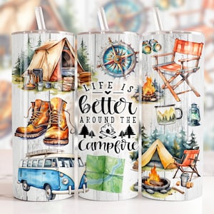 May include: A white tumbler with a woodgrain background and colourful illustrations of camping scenes. The text "Life is better around the campfire" is printed on the tumbler.