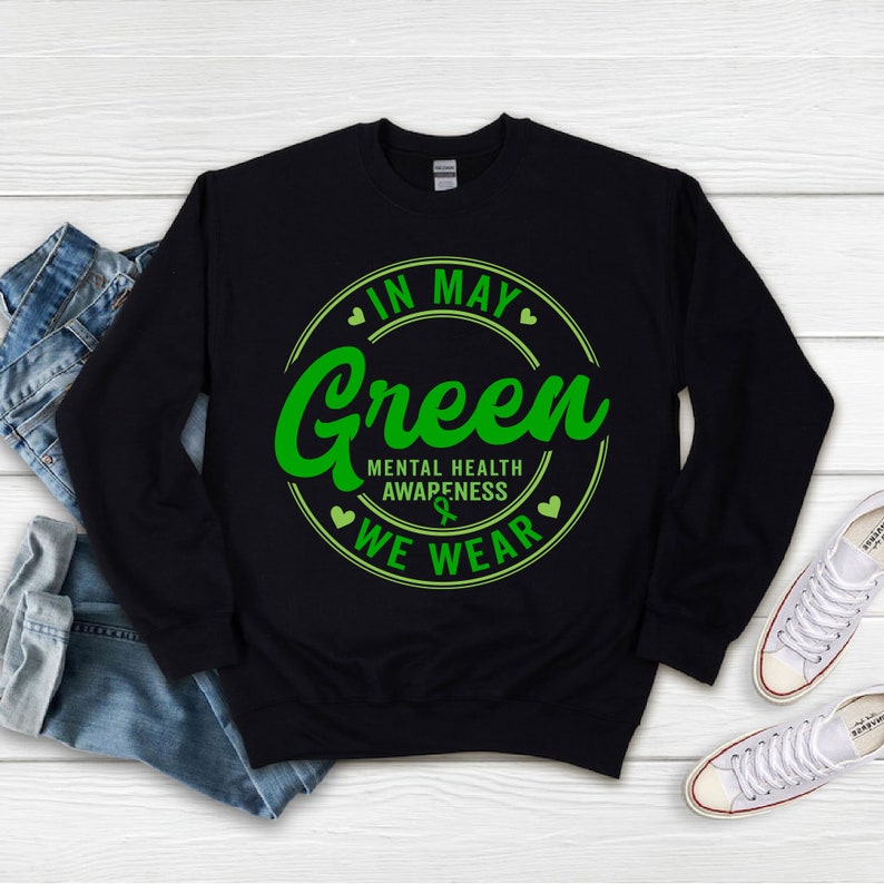 May include: Black sweatshirt with a green circle graphic that says "In May We Wear Green" and "Mental Health Awareness".