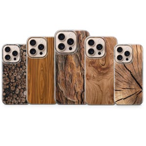 May include: Five phone cases with wood grain designs. The cases feature various wood textures, including bark, knots, and cross-sections. The cases have a clear border around the camera and phone body.