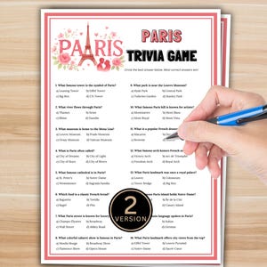 Peut inclure: Une feuille imprimée de jeu-questionnaire sur Paris avec un design rose et blanc. Le titre "Paris Trivia Game" est en haut, avec des questions sur les monuments et la culture parisiens. Une main tenant un stylo bleu pointe vers les réponses.