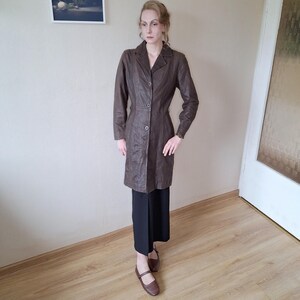Vintage 1990s genuine leather minimalist V neck fitted midi trench jacket in dark brown