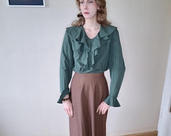 Vintage feminine blouse with jabot ruffle collar in emerald green