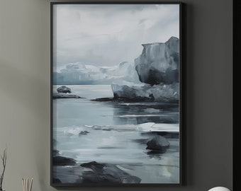 May include: A framed abstract painting of a seascape in shades of grey and blue. The painting depicts a rocky coastline with a body of water in the foreground. The water is calm and reflective, with a few small rocks scattered across the surface.