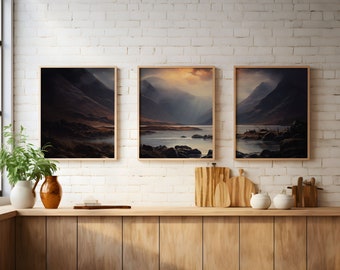 May include: Three framed landscape photographs of a lake and mountains in a misty setting. The photos are hung on a white brick wall above a wooden countertop.