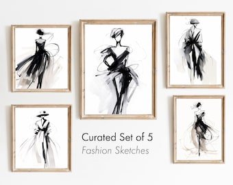 May include: Set of five black and white fashion sketches in minimalist style, framed in natural wood frames. The sketches depict women wearing dresses and coats. The text "Curated Set of 5 Fashion Sketches" is displayed below the frames.