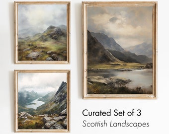 May include: A set of three framed landscape paintings depicting misty Scottish mountains and lakes. The paintings are in a rustic style with muted colors and a sense of tranquility.